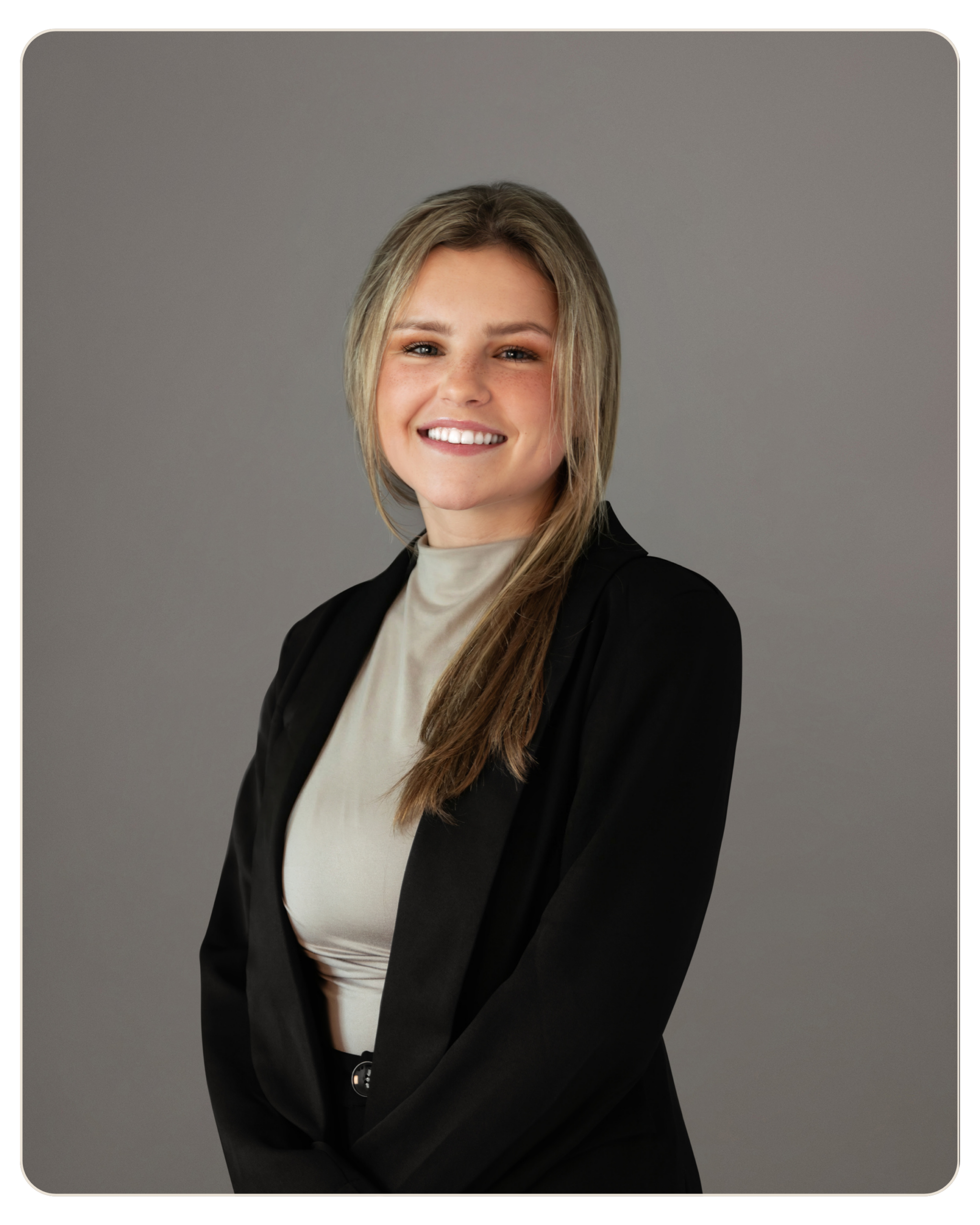MaryJo Yarbrough Professional headshot of a smiling woman with blonde hair, wearing a black blazer and beige blouse, against a gray backdrop.